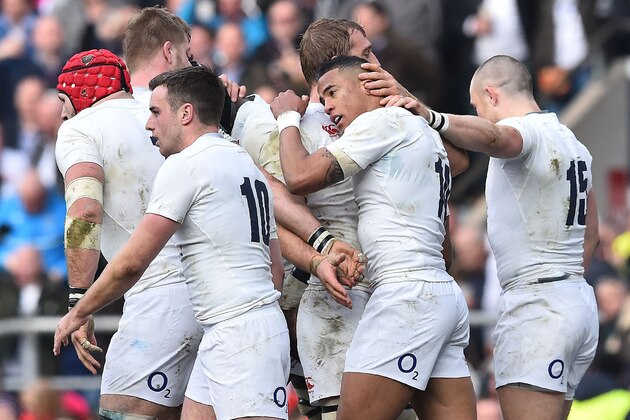 England's wing Anthony Watson (2nd R) is congratulated by teammates after scoring England's first try during the Six Nations international rugby union match between England and Wales at Twickenham in south west London on March 12, 2016.   / AFP / BEN STANSALL        (Photo credit should read BEN STANSALL/AFP/Getty Images)