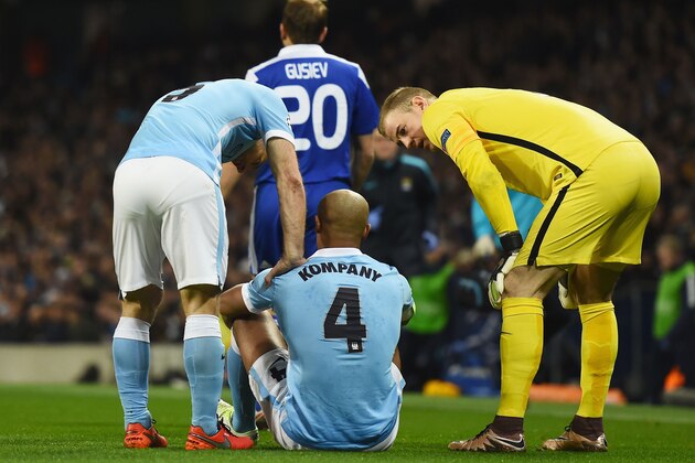 MANCHESTER, ENGLAND - MARCH 15:  An injured Vincent Kompany of Manchester City (4) in discussion with team mates Pablo Zabaleta (L) and Joe Hart (R)  during the UEFA Champions League round of 16 second leg match between Manchester City FC and FC Dynamo Kyiv at the Etihad Stadium on March 15, 2016 in Manchester, United Kingdom.  (Photo by Laurence Griffiths/Getty Images)