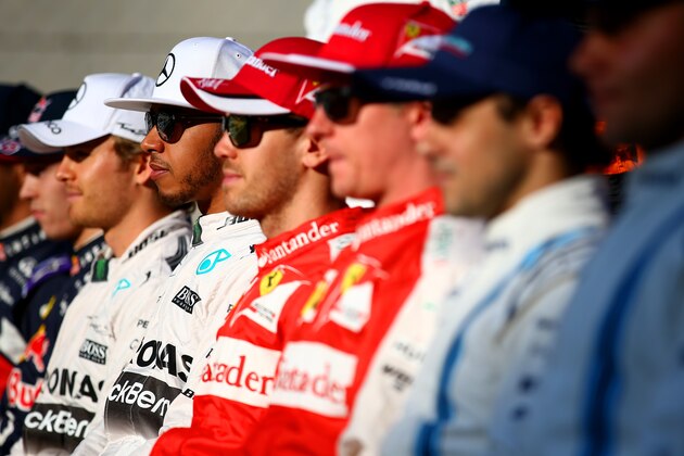 ABU DHABI, UNITED ARAB EMIRATES - NOVEMBER 29:  (L-R) Nico Rosberg of Germany and Mercedes GP, Lewis Hamilton of Great Britain and Mercedes GP, Sebastian Vettel of Germany and Ferrari, Kimi Raikkonen of Finland and Ferrari and Felipe Massa of Brazil and Williams pose for the end of season drivers' photograph on the pit straight before the Abu Dhabi Formula One Grand Prix at Yas Marina Circuit on November 29, 2015 in Abu Dhabi, United Arab Emirates.  (Photo by Mark Thompson/Getty Images)