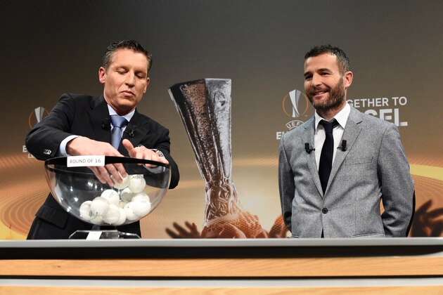 UEFA Head of Club Competitions Michael Heselschwerdt (L) shuffles the balls next to former Swiss forward and this year's UEFA Europa League final ambassador Alexander Frei before holding the round of 16 draw of the UEFA Europa League football championship at the UEFA headquarters in Nyon on February 26, 2016.  AFP PHOTO / ALAIN GROSCLAUDE / AFP / ALAIN GROSCLAUDE        (Photo credit should read ALAIN GROSCLAUDE/AFP/Getty Images)
