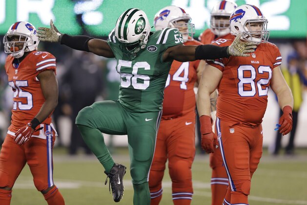 New York Jets inside linebacker Demario Davis (56) reacts after sacking Buffalo Bills quarterback Tyrod Taylor, not pictured, during the first half of an NFL football game, Thursday, Nov. 12, 2015, in East Rutherford, N.J. (AP Photo/Seth Wenig)