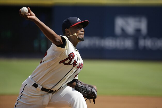 Atlanta Braves starting pitcher Julio Teheran throws in the first inning of a baseball game against the Philadelphia Phillies Sunday, Sept. 20, 2015, in Atlanta. (AP Photo/David Goldman)