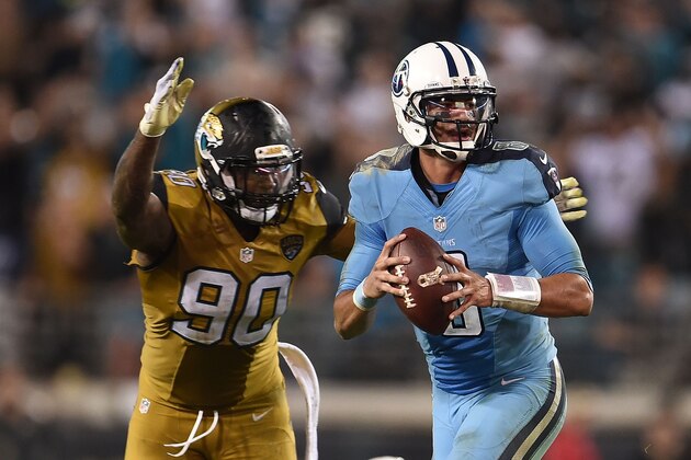 JACKSONVILLE, FL - NOVEMBER 19:  Marcus Mariota #8 of the Tennessee Titans is sacked by Andre Branch #90 of the Jacksonville Jaguars as time expires at EverBank Field on November 19, 2015 in Jacksonville, Florida.  (Photo by Stacy Revere/Getty Images)