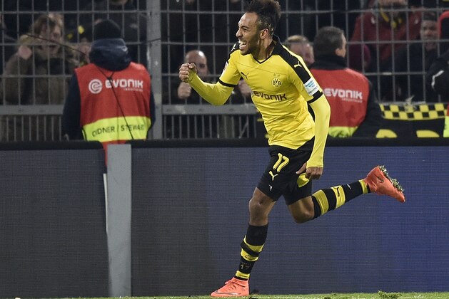 Dortmund's Pierre-Emerick Aubameyang  celebrates his final goal during the German Bundesliga soccer match between Borussia Dortmund and TSG 1899 Hoffenheim in Dortmund, Germany, Sunday, Feb. 28, 2016. Dortmund defeated Hoffenheim with 3-1. (AP Photo/Martin Meissner)