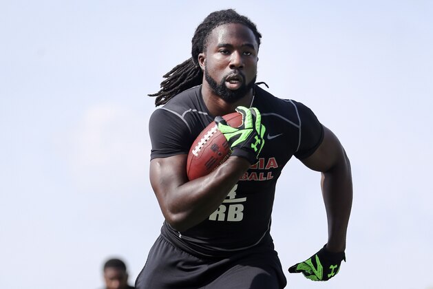 Running back Keith Marshall runs a drill in front of NFL football scouts during Georgia's Pro Day, Wednesday, March 16, 2016, in Athens, Ga. (AP Photo/John Bazemore)