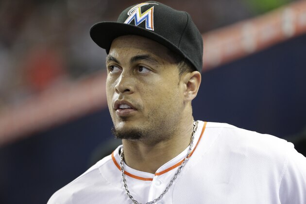 Miami Marlins right fielder Giancarlo Stanton is shown in the dugout before the start of a baseball game against the St. Louis Cardinals, Tuesday, June 23, 2015, in Miami. (AP Photo/Wilfredo Lee)