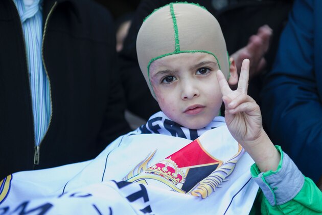 Five year old Palestinian boy who survived a firebombing by Jewish extremists that killed his parents and brother Ahmed Dawabsha arrives at Adolfo Suarez Airport near Madrid on March 16, 2016 priot to meeting Real Madrid football stars including his idol Cristiano Ronaldo.


The July 31 attack on the Dawabsha family home in the village of Duma in the occupied West Bank killed 18-month-old Ali Saad Dawabsha and fatally wounded his parents.

 / AFP / CURTO DE LA TORRE        (Photo credit should read CURTO DE LA TORRE/AFP/Getty Images)