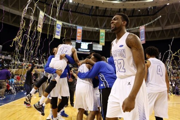 Hampton celebrate following their 81-69 victory over South Carolina State in an NCAA college basketball game in the championship of the Mid-Eastern Athletic Conference men's tournament in Norfolk, Va., Saturday, March 12, 2016. (AP Photo/Chet Strange)