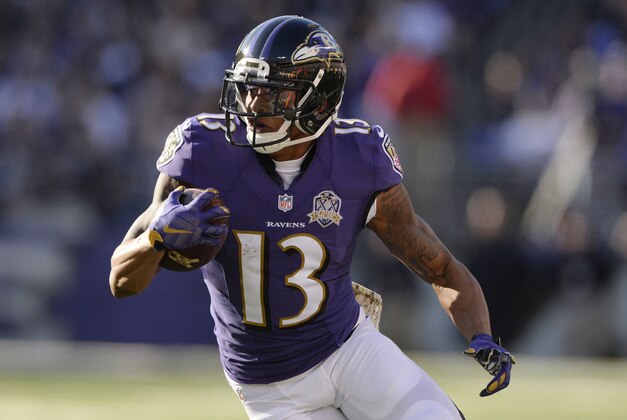 Nov 15, 2015; Baltimore, MD, USA; Baltimore Ravens wide receiver Chris Givens (13) carries the ball during the second quarter against the Jacksonville Jaguars at M&T Bank Stadium. Mandatory Credit: Tommy Gilligan-USA TODAY Sports