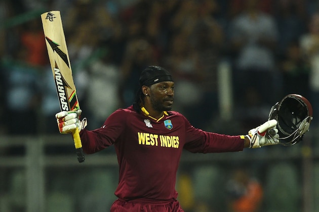 West Indies's Chris Gayle celebrates after scoring his century (100runs) during the World T20 cricket tournament match between England and West Indies at The Wankhede Cricket Stadium in Mumbai on March 16, 2016.
 / AFP / INDRANIL MUKHERJEE        (Photo credit should read INDRANIL MUKHERJEE/AFP/Getty Images)