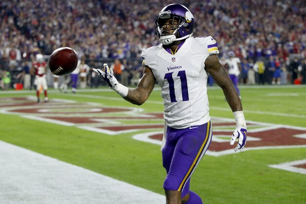 Minnesota Vikings wide receiver Mike Wallace (11) tosses the ball to the official after a touchdown catch against the Arizona Cardinals during the second half of an NFL football game, Thursday, Dec. 10, 2015, in Glendale, Ariz. (AP Photo/Rick Scuteri)