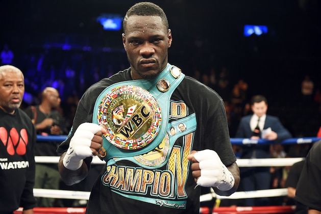 Deontay Wilder of the US celebrates defeating Artur Szpilka of Poland following their WBC Heavyweight Championship bout at Barclay's Center in Brooklyn, New York, on January 16, 2016. 
Wilder won via ninth round knock out.  / AFP / AFP PHOTO / DON EMMERT        (Photo credit should read DON EMMERT/AFP/Getty Images)
