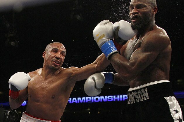 FILE - In this Sept. 8, 2012, file photo, Andre Ward, left, punches Chad Dawson during the sixth round of a WBA/WBC super middleweight championship boxing match in Oakland, Calif. Ward has been out of the ring for 14 months, beset by injuries, a spat with his promoter and the inability to find a suitable opponent. The unbeaten super middleweight star returns Saturday against unbeaten Edwin Rodriguez with his eye on bigger fights in 2014. (AP Photo/Jeff Chiu, File)