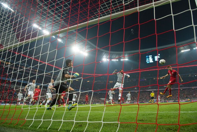 Juventus' goalkeeper from Italy Gianluigi Buffon fails to save Bayern Munich's midfielder Thomas Mueller's (R) header for 2-2 during the UEFA Champions League, Round of 16, second leg football match FC Bayern Munich v Juventus in Munich, southern Germany on March 16, 2016. / AFP / ODD ANDERSEN        (Photo credit should read ODD ANDERSEN/AFP/Getty Images)