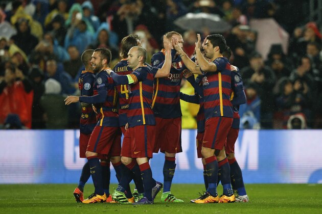 Players of FC Barcelona celebrate their side's first goal during the Champions League round of 16 second leg soccer match between FC Barcelona and Arsenal FC at the Camp Nou stadium in Barcelona, Spain, Wednesday, March 16, 2016. (AP Photo/Manu Fernandez)