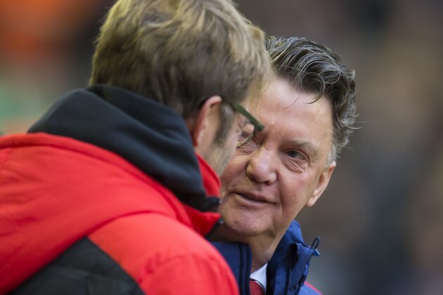 Manchester United's manager Louis van Gaal, right, greets Liverpool's manager Juergen Klopp before the English Premier League soccer match between Liverpool and Manchester United at Anfield Stadium, Liverpool, England, Sunday, Jan. 17, 2016. (AP Photo/Jon Super)