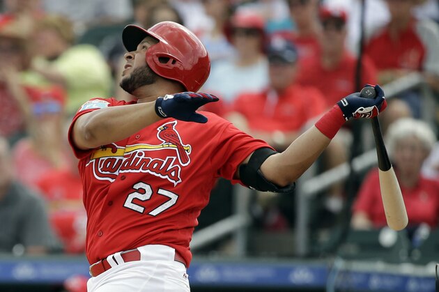 St. Louis Cardinals' Jhonny Peralta singles during the third inning of an exhibition spring training baseball game against the Miami Marlins Thursday, March 3, 2016, in Jupiter, Fla. (AP Photo/Jeff Roberson)