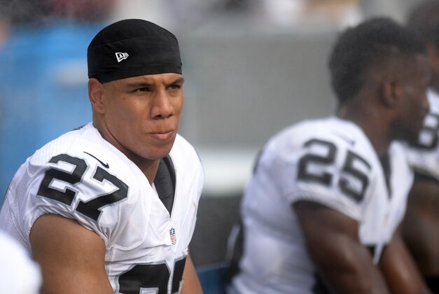 Oct 25, 2015; San Diego, CA, USA; Oakland Raiders strong safety Taylor Mays (27) looks on from the bench during the fourth quarter against the San Diego Chargers at Qualcomm Stadium. Mandatory Credit: Jake Roth-USA TODAY Sports