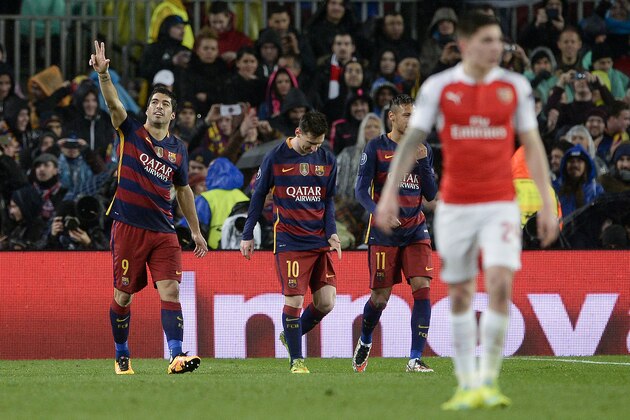 Barcelona's Uruguayan forward Luis Suarez (L) celebrates his goal during the UEFA Champions League Round of 16 second leg football match FC Barcelona vs Arsenal FC at the Camp Nou stadium in Barcelona on March 16, 2016.  / AFP / JOSEP LAGO        (Photo credit should read JOSEP LAGO/AFP/Getty Images)