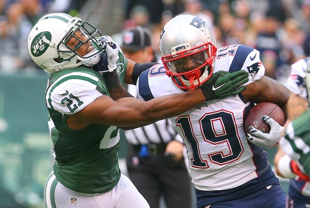Dec 27, 2015; East Rutherford, NJ, USA; New England Patriots wide receiver Brandon LaFell (19) runs with the ball while New York Jets free safety Marcus Gilchrist (21) attempts to tackle him during the first half at MetLife Stadium. Mandatory Credit: Ed Mulholland-USA TODAY Sports