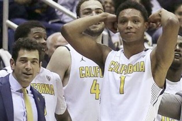 FILE - In this Feb. 11, 2016, file photo California assistant basketball coach Yann Hufnagel, left, is seen on the bench with players Kameron Rooks, center, and Ivan Rabb (1) during an NCAA college basketball game against Oregon in Berkeley, Calif. The team's head coach is moving to fire Hufnagel who violated the school's sexual harassment policy. It comes as the university has faced criticism for its handling of substantiated sexual harassment allegations involving an astronomy professor and the dean of Berkeley's law school. The athletic department said in a statement Monday that Hufnagel has been suspended pending termination proceedings. He won't be traveling with the team during the upcoming NCAA Men's Basketball Tournament. (AP Photo/Ben Margot, File)
