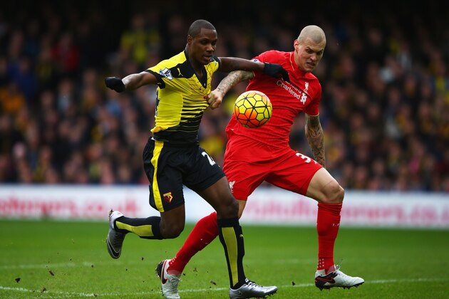 WATFORD, ENGLAND - DECEMBER 20:  Odion Ighalo of Watford holds off Martin Skrtel of Liverpool as he scores their second goal during the Barclays Premier League match between Watford and Liverpool at Vicarage Road on December 20, 2015 in Watford, England.  (Photo by Ian Walton/Getty Images)