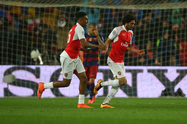 BARCELONA, SPAIN - MARCH 16:  Mohamed Elneny of Arsenal celebrates scoring with Alex Iwobi of Arsenal during the UEFA Champions League Round of 16 Second Leg match between FC Barcelona and Arsenal FC at Camp Nou on March 16, 2016 in Barcelona,Spain. (Photo by Ian MacNicol/Getty Images)