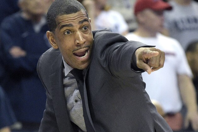 Connecticut head coach Kevin Ollie shouts instructions from the sideline during the first half of an NCAA college basketball game against Memphis in the finals of the American Athletic Conference men's tournament in Orlando, Fla., Sunday, March 13, 2016. (AP Photo/Phelan M. Ebenhack)