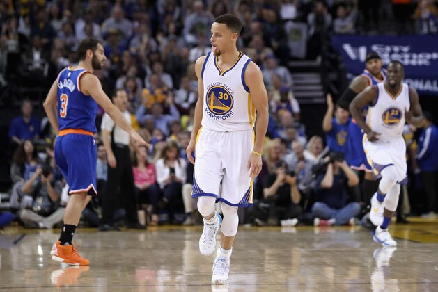 OAKLAND, CA - MARCH 16:  Stephen Curry #30 of the Golden State Warriors reacts after making a three-point basket against the New York Knicks at ORACLE Arena on March 16, 2016 in Oakland, California. NOTE TO USER: User expressly acknowledges and agrees that, by downloading and or using this photograph, User is consenting to the terms and conditions of the Getty Images License Agreement.  (Photo by Ezra Shaw/Getty Images)