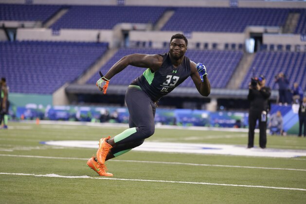 Clemson defensive lineman Shaq Lawson runs a drill at the NFL football scouting combine in Indianapolis, Sunday, Feb. 28, 2016. (AP Photo/Michael Conroy)