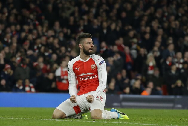 Arsenal's Olivier Giroud reacts after missing a chance to score during the Champions League round of 16 first leg soccer match between Arsenal and Barcelona at the Emirates stadium London, Tuesday, Feb. 23, 2016. (AP Photo/Matt Dunham)