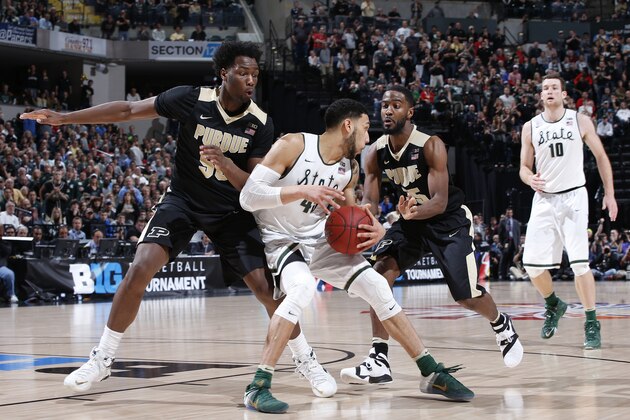INDIANAPOLIS, IN - MARCH 13: Rapheal Davis #35 and Caleb Swanigan #50 of the Purdue Boilermakers defend against Denzel Valentine #45 of the Michigan State Spartans in the championship game of the Big Ten Basketball Tournament at Bankers Life Fieldhouse on March 13, 2016 in Indianapolis, Indiana. Michigan State defeated Purdue 66-62. (Photo by Joe Robbins/Getty Images)