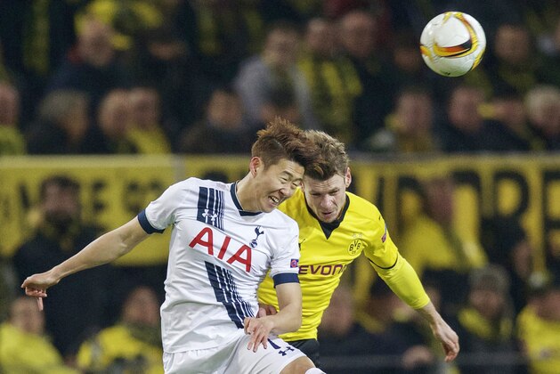 (L-R) Son Heung-Min of Tottenham Hotspur FC, Lukasz Piszczek of Borussia Dortmund during the UEFA Europa League round of 16 match between Borussia Dortmund and Tottenham Hotspur on March 10, 2016 at the Signal Iduna Park stadium in Dortmund, Germany.(Photo by VI Images via Getty Images)