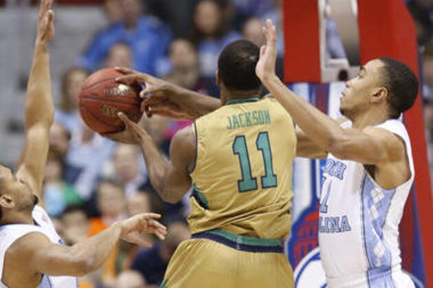 Notre Dame guard Demetrius Jackson, right blocks the shot of North Carolina forward Brice Johnson (11) with the help of Joel Berry II, left, during the first half of an NCAA college basketball game in the Atlantic Coast Conference men's tournament, Friday, March 11, 2016, in Washington. (AP Photo/Steve Helber)