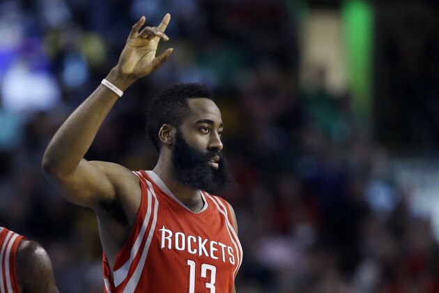 Houston Rockets guard James Harden (13) gestures in the fourth quarter of an NBA basketball game against the Boston Celtics, Friday, March 11, 2016, in Boston. Harden scored 32 points to lead the Rockets to a 102-98 victory over the Celtics. (AP Photo/Elise Amendola)