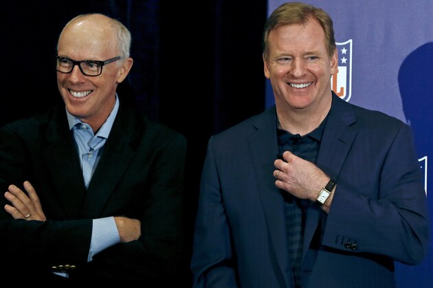 NFL Commissioner Roger Goodell, right, laughs along with Rich McKay, Atlanta Falcons president and CEO and co-chairman of the competition committee, during a news conference at the annual NFL football meetings at the Arizona Biltmore, Wednesday, March 20, 2013, in Phoenix. (AP Photo/Ross D. Franklin)
