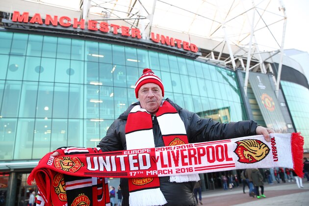 MANCHESTER, ENGLAND - MARCH 17:  Match day scarves are sold outside the stadium prior to the UEFA Europa League round of 16, second leg match between Manchester United and Liverpool at Old Trafford on March 17, 2016 in Manchester, England.  (Photo by Clive Brunskill/Getty Images)