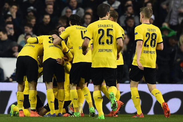 Borussia Dortmund's Gabonese striker Pierre-Emerick Aubameyang celebrates with teammates after scoring the opening goal of the UEFA Europa League round of 16, second leg football match between Tottenham Hotspur and Borussia Dortmund at White Hart Lane in London on March 17, 2016. / AFP / Ben STANSALL (Photo credit should read BEN STANSALL/AFP/Getty Images) Borussia Dortmund's Gabonese striker Pierre-Emerick Aubameyang celebrates with teammates after scoring the opening goal of the UEFA Europa League round of 16, second leg football match between Tottenham Hotspur and Borussia Dortmund at White Hart Lane in London on March 17, 2016. / AFP / Ben STANSALL (Photo credit should read BEN STANSALL/AFP/Getty Images)