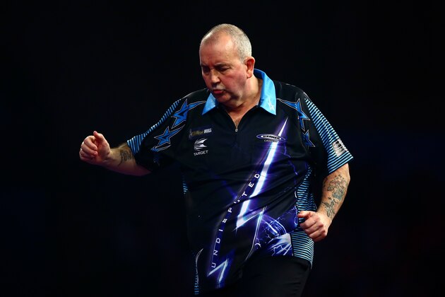 LONDON, ENGLAND - DECEMBER 30:  Phil Taylor of England looks dejected in his third round match against Jelle Klaasen of the Netherlands on Day Twelve of the 2016 William Hill PDC World Darts Championships at Alexandra Palace on December 30, 2015 in London, England.  (Photo by Jordan Mansfield/Getty Images)