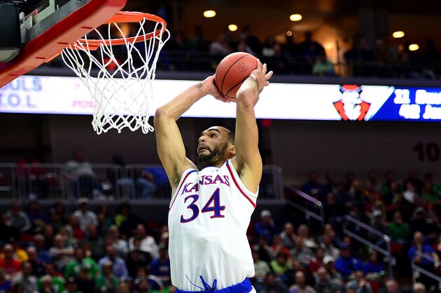 Mar 17, 2016; Des Moines, IA, USA; Kansas Jayhawks forward Perry Ellis (34) dunks the ball against Austin Peay Governors guard Jared Savage (2) during the second half in the first round of the 2016 NCAA Tournament at Wells Fargo Arena. Mandatory Credit: Jeffrey Becker-USA TODAY Sports