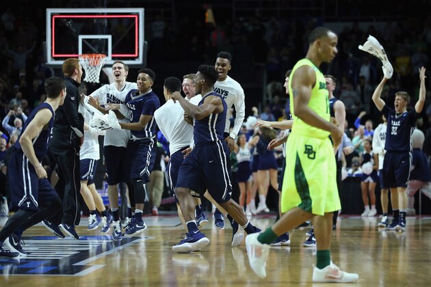 PROVIDENCE, RI - MARCH 17:  The Yale Bulldogs celebrate defeating the Baylor Bears 79-75 during the first round of the 2016 NCAA Men's Basketball Tournament at Dunkin' Donuts Center on March 17, 2016 in Providence, Rhode Island.  (Photo by Jim Rogash/Getty Images)