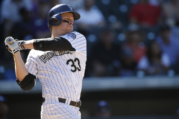 Colorado Rockies first baseman Justin Morneau (33) strikes out against San Diego Padres starting pitcher James Shields (33) in the fourth inning of a baseball game Sunday, Sept. 20, 2015, in Denver. San Diego won 10-4. (AP Photo/David Zalubowski)