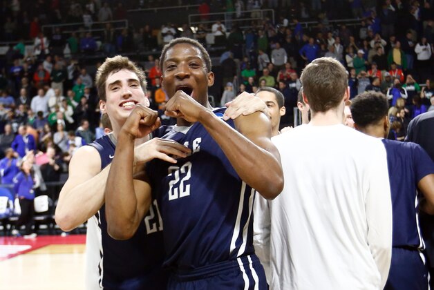 Mar 17, 2016; Providence, RI, USA; Yale Bulldogs forward Justin Sears (22) and guard Nick Victor (21) celebrate after their win over Baylor during a first round game during the 2016 NCAA Tournament at Dunkin Donuts Center. Mandatory Credit: Mark L. Baer-USA TODAY Sports