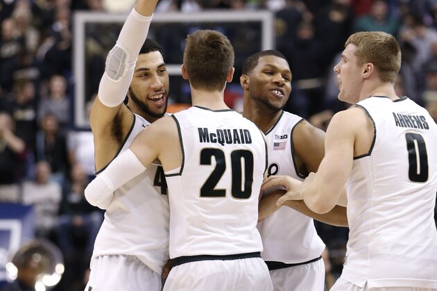 Michigan State's Denzel Valentine, left, celebrates with his teammates after an NCAA college basketball game against Purdue in the finals at the Big Ten Conference tournament, Sunday, March 13, 2016, in Indianapolis. Michigan State won 66-62. (AP Photo/AJ Mast)
