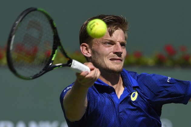 David Goffin, of Belgium, returns a shot to Marin Cilic, of Croatia, at the BNP Paribas Open tennis tournament, Thursday, March 17, 2016, in Indian Wells, Calif. Goffin won 7-6 (4), 6-2. (AP Photo/Mark J. Terrill)