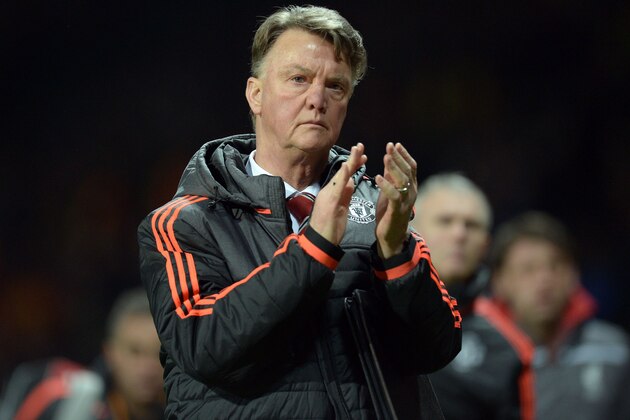Manchester United's Dutch manager Louis van Gaal applauds supporters after the UEFA Europa League round of 16, second leg football match between Manchester United and Liverpool at Old Trafford in Manchester, north west England on March 17, 2016.
The game ended 1-1, Liverpool going through 3-1 on aggregate. / AFP / OLI SCARFF        (Photo credit should read OLI SCARFF/AFP/Getty Images)