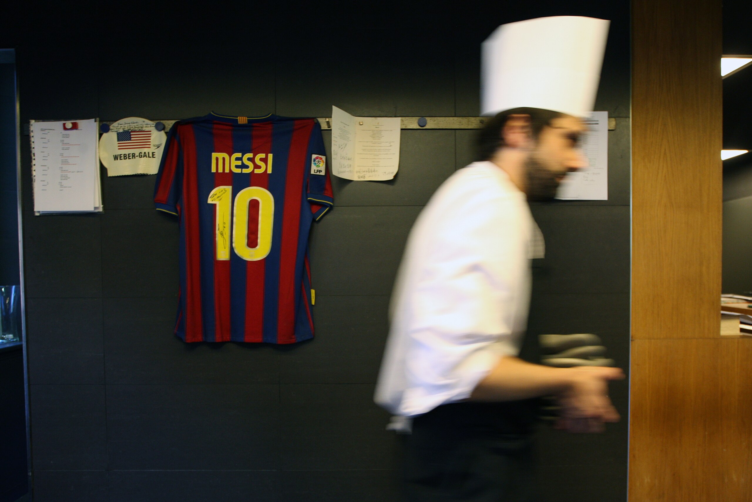 An employee of 'El Celler de Can Roca' walks past various items signed by famous customers, including a jersey of football player Lionel Messi, in the restaurant's kitchen in Girona on April 30, 2013. Spain's El Celler de Can Roca seized the title of the world's best restaurant from Denmark's Noma on April 29, one month after dozens of people came down with a bout of food poisoning from the Copenhagen eatery. The restaurant in Girona, run by three brothers and known for its dishes based on perfumes, had spent two years as runner-up on the World's 50 Best Restaurants list compiled for a 12th year by more than 900 international experts for Britain's Restaurant magazine. AFP PHOTO / QUIQUE GARCIA (Photo credit should read QUIQUE GARCIA/AFP/Getty Images) An employee of 'El Celler de Can Roca' walks past various items signed by famous customers, including a jersey of football player Lionel Messi, in the restaurant's kitchen in Girona on April 30, 2013. Spain's El Celler de Can Roca seized the title of the world's best restaurant from Denmark's Noma on April 29, one month after dozens of people came down with a bout of food poisoning from the Copenhagen eatery. The restaurant in Girona, run by three brothers and known for its dishes based on perfumes, had spent two years as runner-up on the World's 50 Best Restaurants list compiled for a 12th year by more than 900 international experts for Britain's Restaurant magazine. AFP PHOTO / QUIQUE GARCIA (Photo credit should read QUIQUE GARCIA/AFP/Getty Images)
