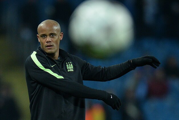 Manchester City's Belgian defender Vincent Kompany warms up ahead of a UEFA Champions League last 16, second leg football match between Manchester City and Dynamo Kiev at the Etihad Stadium in Manchester, north west England, on March 15, 2016. / AFP / OLI SCARFF        (Photo credit should read OLI SCARFF/AFP/Getty Images)