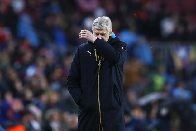 Arsenal's manager Arsene Wenger walks alongside the pitch during the Champions League round of 16 second leg soccer match between FC Barcelona and Arsenal FC at the Camp Nou stadium in Barcelona, Spain, Wednesday, March 16, 2016. (AP Photo/Manu Fernandez)