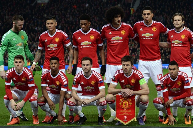 Manchester United team (L-R back row) Manchester United's Spanish goalkeeper David de Gea, Manchester United's Argentinian defender Marcos Rojo, Manchester United's French striker Anthony Martial, Manchester United's Belgian midfielder Marouane Fellaini, Manchester United's English defender Chris Smalling and Manchester United's Dutch midfielder Daley Blind (L-R front row) Manchester United's Uruguayan defender Guillermo Varela, Manchester United's English striker Marcus Rashford, Manchester United's Spanish midfielder Juan Mata, Manchester United's English midfielder Michael Carrick and Manchester United's English midfielder Jesse Lingard line-up ahead of the UEFA Europa League round of 16, second leg football match between Manchester United and Liverpool at Old Trafford in Manchester, north west England on March 17, 2016.
The game ended 1-1, Liverpool going through 3-1 on aggregate. / AFP / OLI SCARFF        (Photo credit should read OLI SCARFF/AFP/Getty Images)